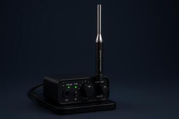 Compact audio calibration rig with reference mic