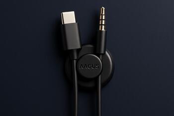 Magnetic cable anchor holding USB-C and AUX