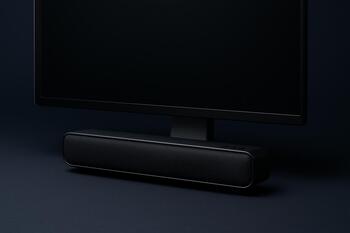 Mini soundbar tucked under a monitor