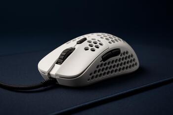 Ultralight gaming mouse on soft desk mat